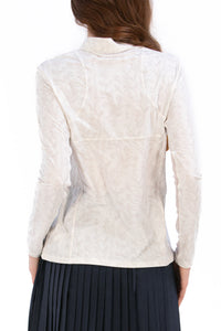 Woman wearing a White Textured Floral long-sleeve sun blocking top with a zipper, standing against a white background.