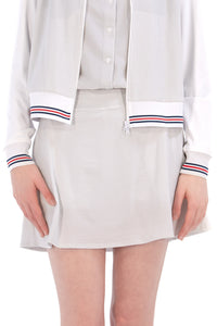 Woman wearing seersucker grey skirt