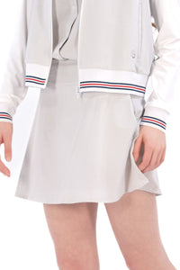 Woman wearing seersucker grey skirt