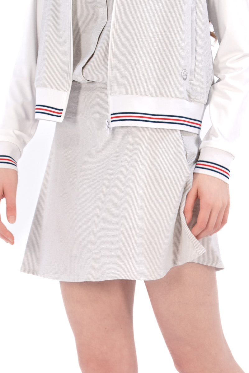 Woman wearing seersucker grey skirt