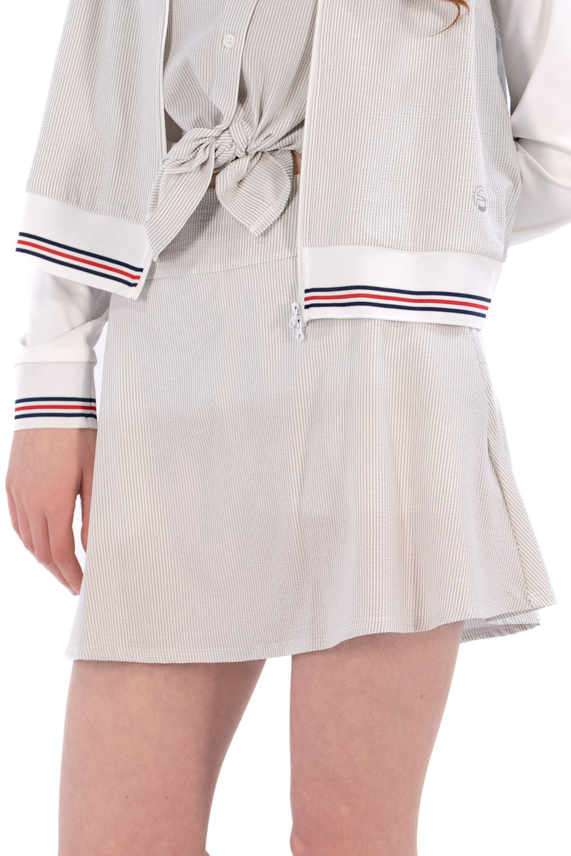 Woman wearing seersucker grey skirt