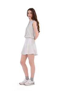 Woman wearing seersucker grey skirt