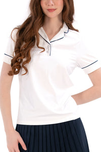 Woman wearing a white/navy top and navy skirt on a white background