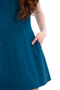 Woman wearing a Blue Opal dress on a white background