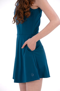 Woman wearing a Blue Opal dress on a white background