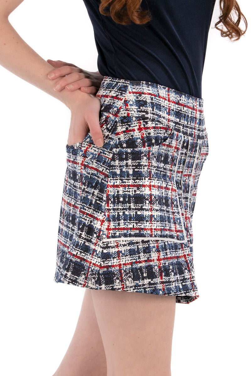 Woman wearing a navy polo shirt and plaid skirt on a white background Regular 15.5"