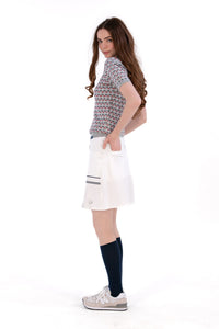 Woman in Regular 15" white skirt and knit polo.