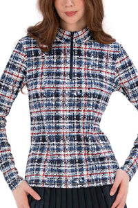 Woman wearing a Red White Blue Plaid shirt and navy pleated skirt on a white background