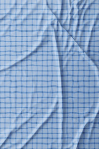 Woman wearing a Light Blue Geo long-sleeve sun blocking top with a zipper, standing against a white background.